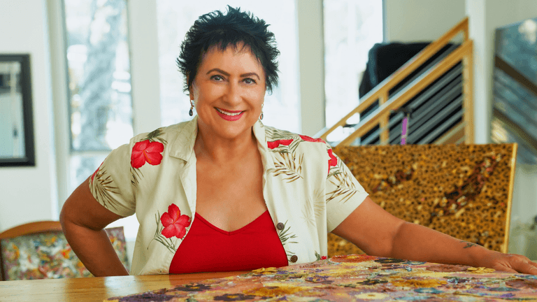 Diana Kemp creating vibrant mixed-media dreamscapes, transforming intuition into expressive artwork, showcasing creativity, storytelling, and emerging artistic recognition.