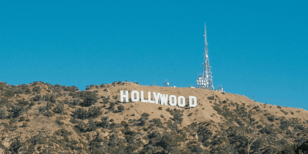 Hollywood sign on a hillside with a clear blue sky backdrop
