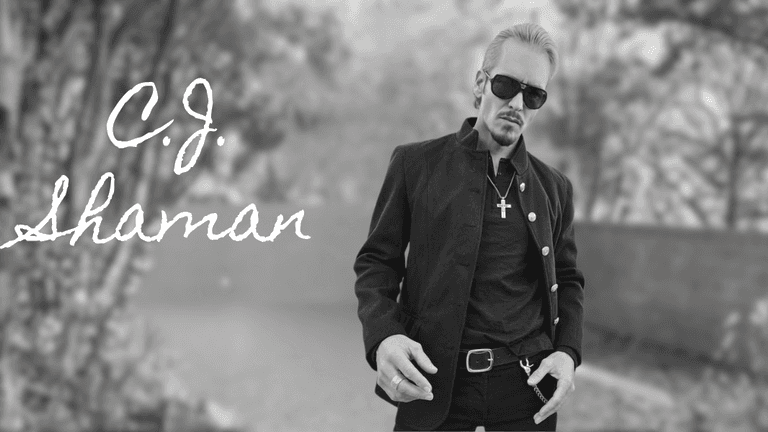 C.J. Shaman, a rebellious rock artist with a bold, raw style, exudes confidence and defiance, embodying rock's spirit.