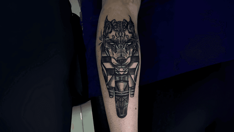 A detailed black-and-white tattoo of a wolf with geometric and mythological elements, created at Riders Studios Tattoos. Known for its commitment to personalized artistry, the studio blends cultural depth with professional tattooing, offering clients in Cairo and Amman unique, meaningful designs.