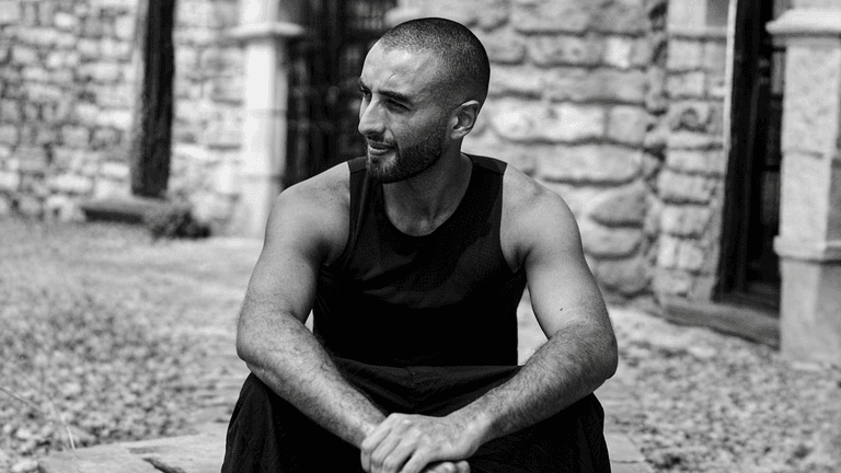 Kaikhan Salakhov, multidisciplinary artist, exploring humanity's future through art, science, and philosophy in the realm of space exploration.