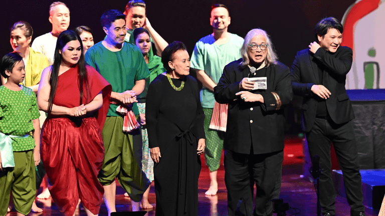Composer Somtow Sucharitkul presenting Mae Naak opera revival, blending Thai horror storytelling with modern operatic performance on a theatrical stage