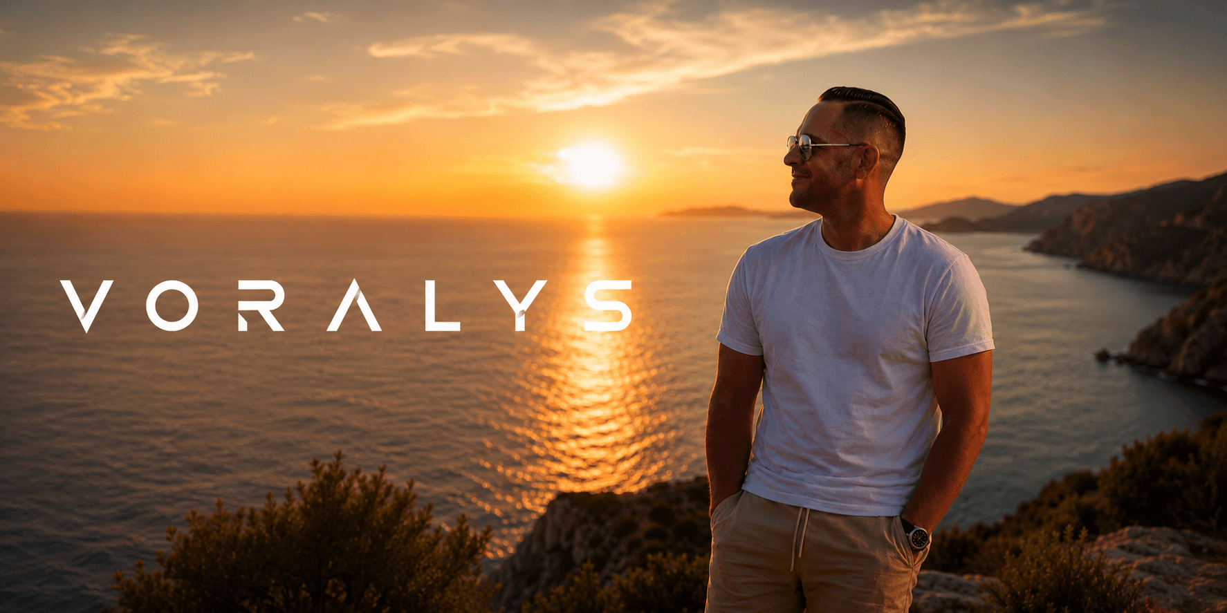 A man stands by the sea at sunset, with the name Voralys displayed.