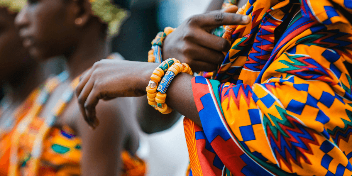 Vibrant traditional attire with colorful patterns and jewelry worn during a cultural celebration