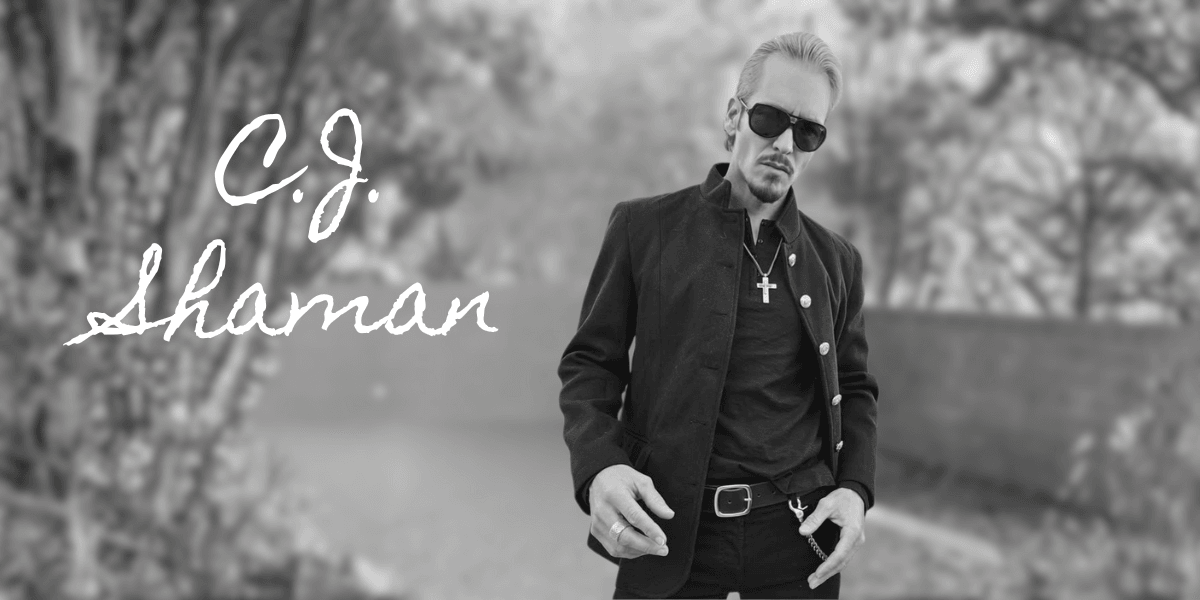C.J. Shaman, a rebellious rock artist with a bold, raw style, exudes confidence and defiance, embodying rock's spirit.