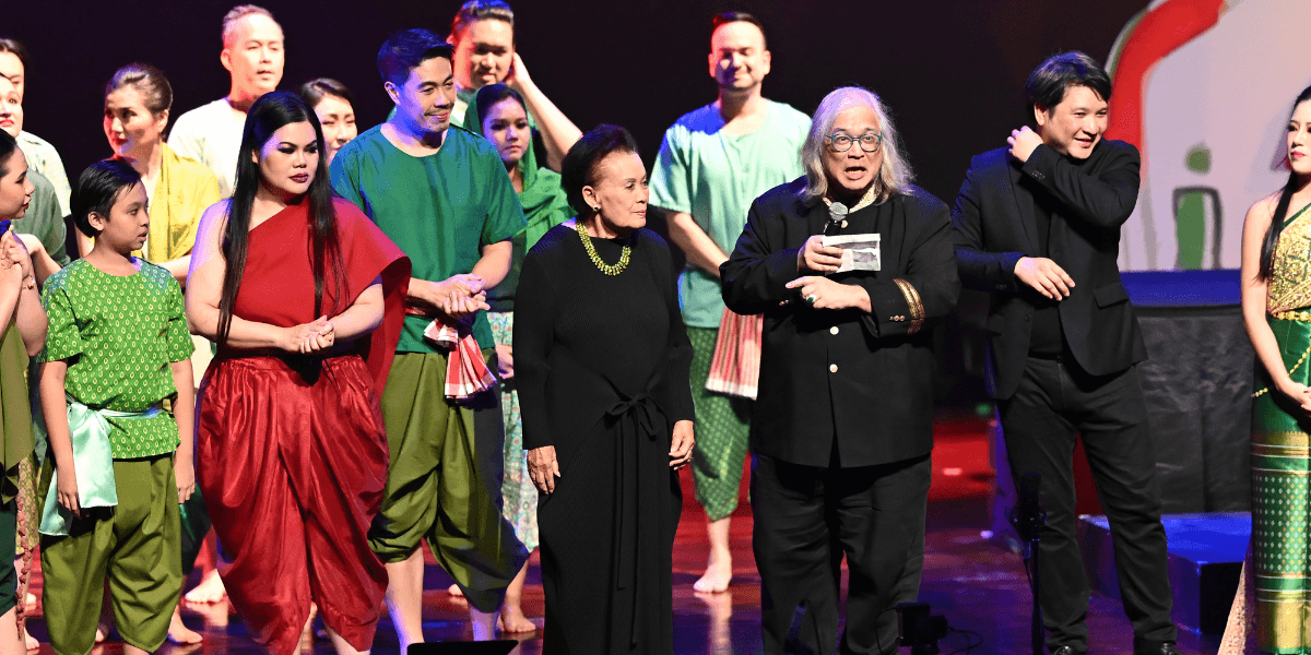 Composer Somtow Sucharitkul presenting Mae Naak opera revival, blending Thai horror storytelling with modern operatic performance on a theatrical stage