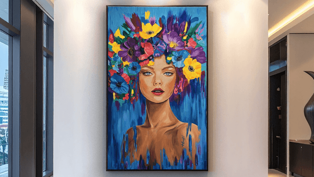 Vibrant painting of a woman with a floral headdress displayed on a wall