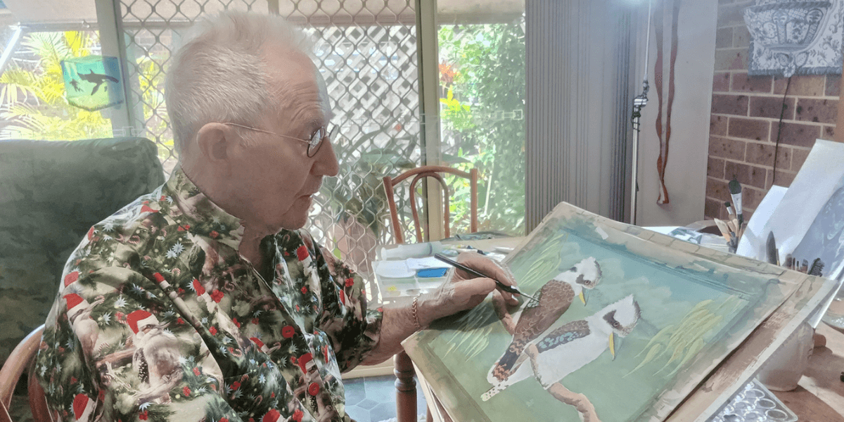 Les Peterkin OAM painting a kookaburra, part of his "Laughing Kookaburras" exhibition preparation.