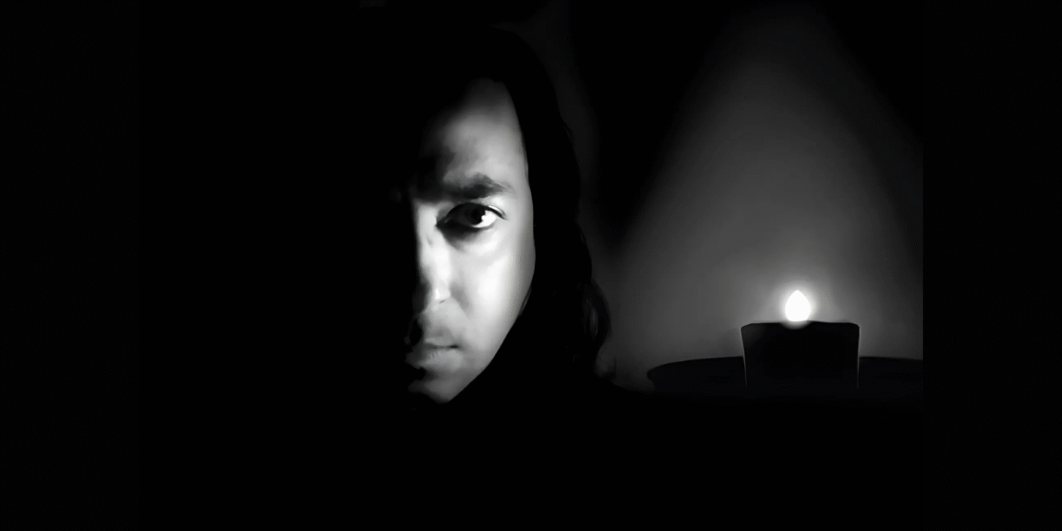 Explore the striking contrast and emotional depth of this black and white portrait featuring a mysterious figure illuminated by candlelight. Perfect for capturing the essence of drama and emotion in photography