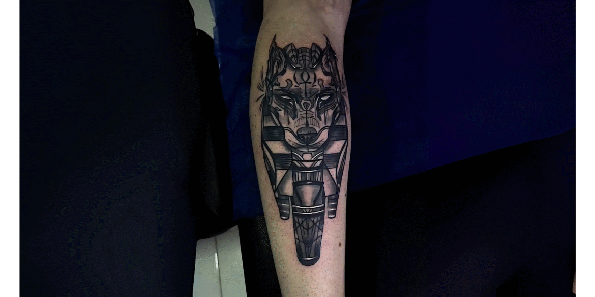 A detailed black-and-white tattoo of a wolf with geometric and mythological elements, created at Riders Studios Tattoos. Known for its commitment to personalized artistry, the studio blends cultural depth with professional tattooing, offering clients in Cairo and Amman unique, meaningful designs.