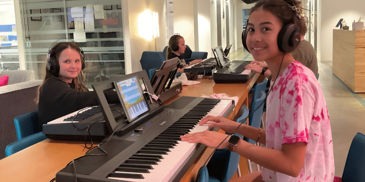Students engaged in Obbligato Music's Piano Playground program, learning piano in a fun, supportive, and community-focused environment.