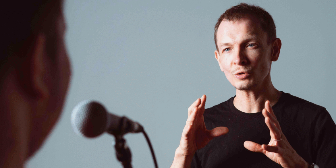 Vocal coach Antoine Rudi explaining vocal techniques to a student.