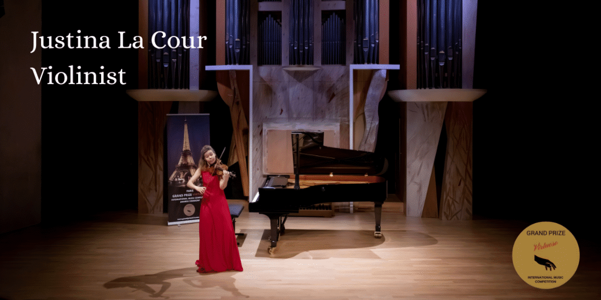 Justina la Cour performing at a concert with a piano in the background.