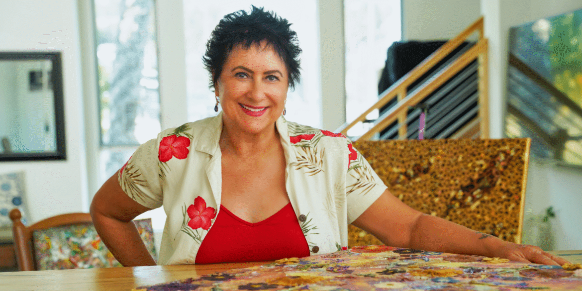 Diana Kemp creating vibrant mixed-media dreamscapes, transforming intuition into expressive artwork, showcasing creativity, storytelling, and emerging artistic recognition.